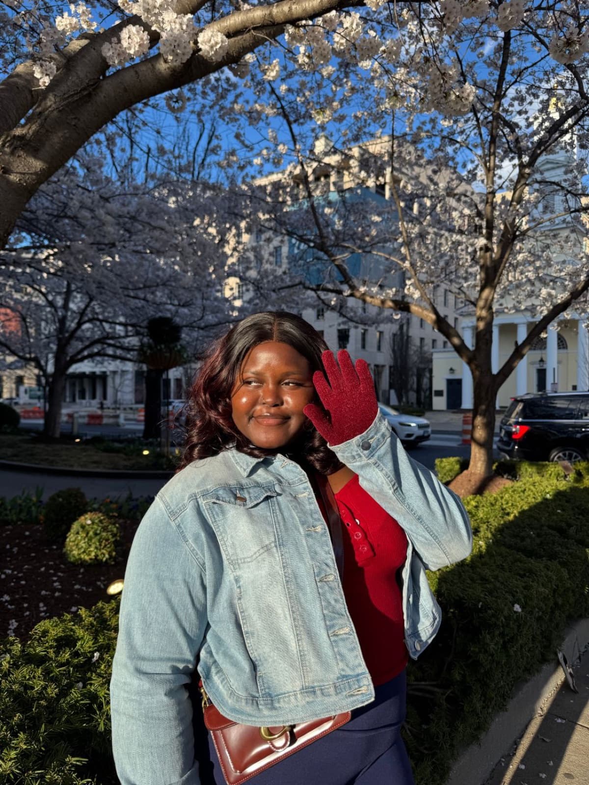 Taslemat Yusuf under cherry blossoms in Washington DC