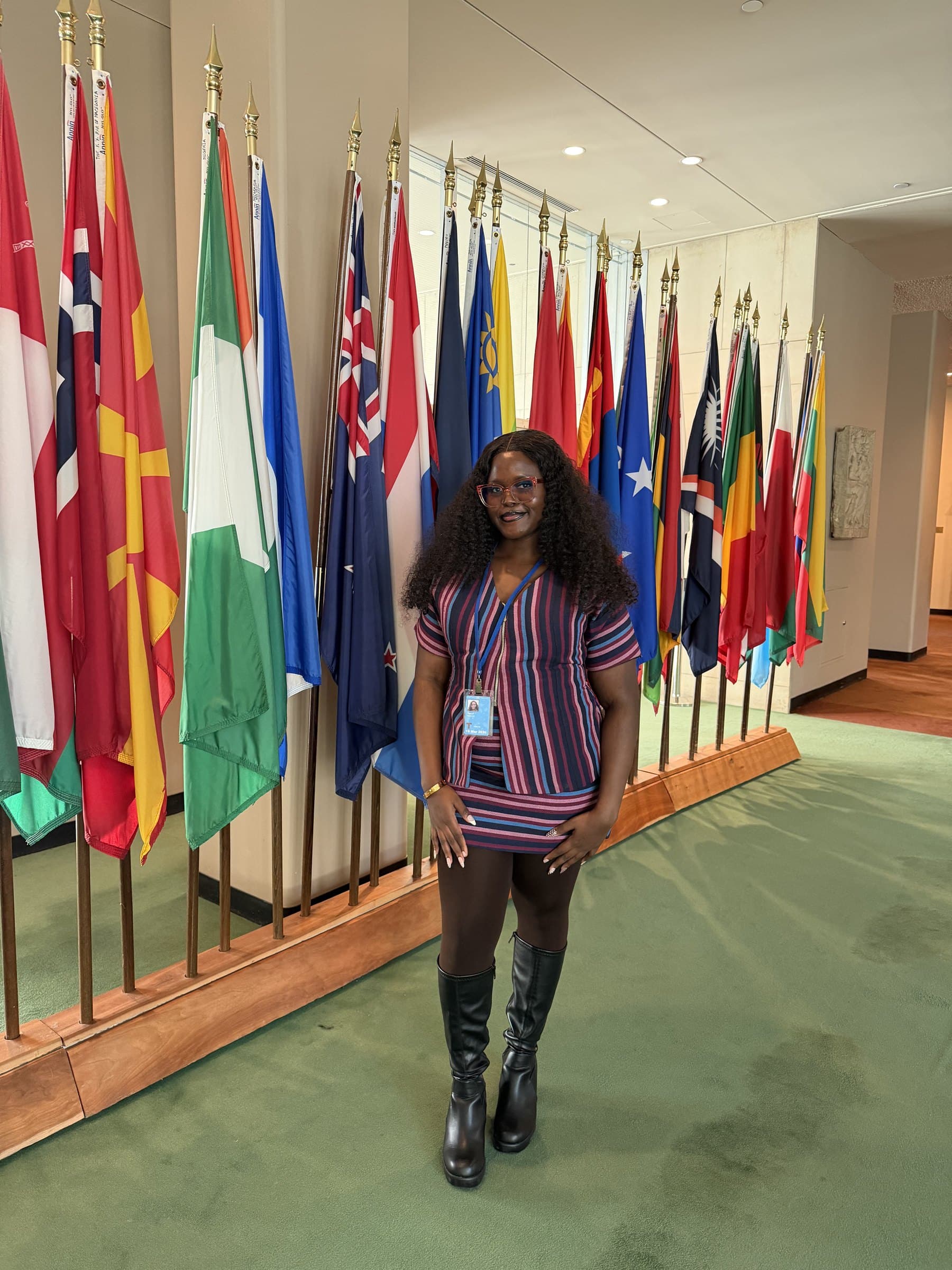 Taslemat Yusuf at the UN flag wall